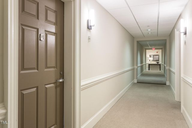 a view of an empty room with windows