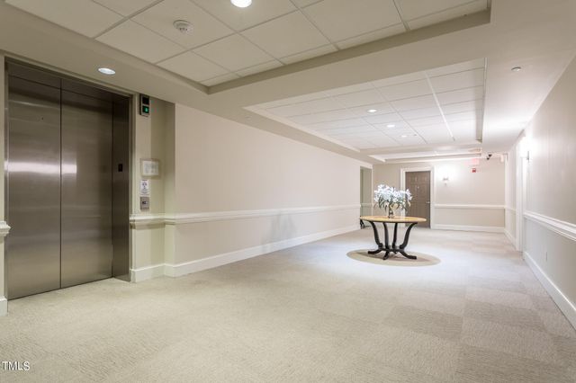 a view of a livingroom with furniture and a window