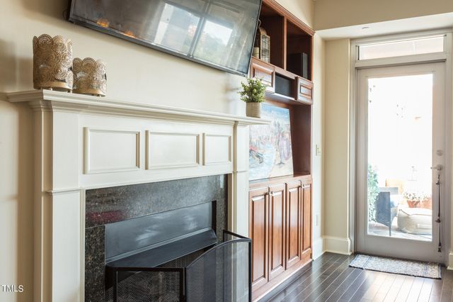 a kitchen with a refrigerator and cabinets