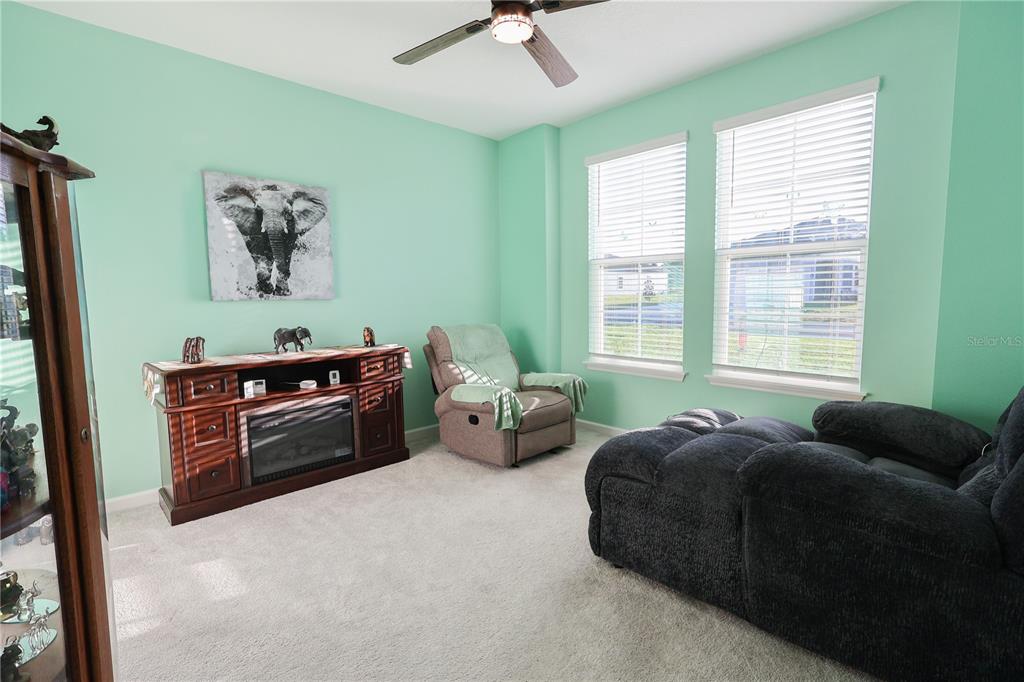 19511 Southwest 77th Loop Dunnellon, FL 34432 - Photo 15 of 27 a bed room with furniture and a window