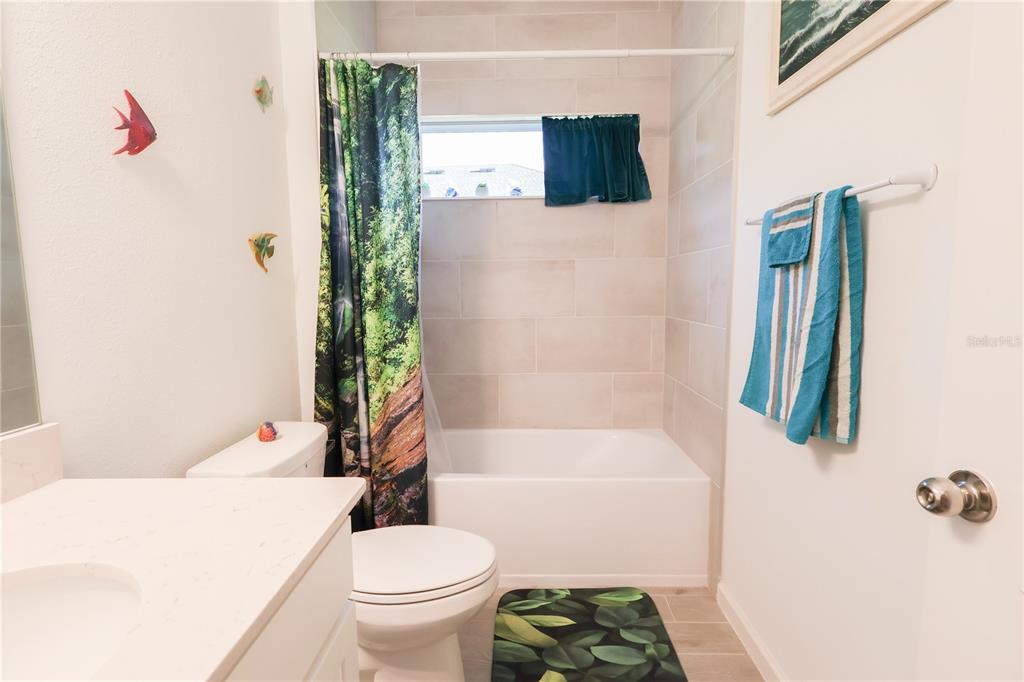 19511 Southwest 77th Loop Dunnellon, FL 34432 - Photo 16 of 27 a bathroom with a sink a toilet and shower