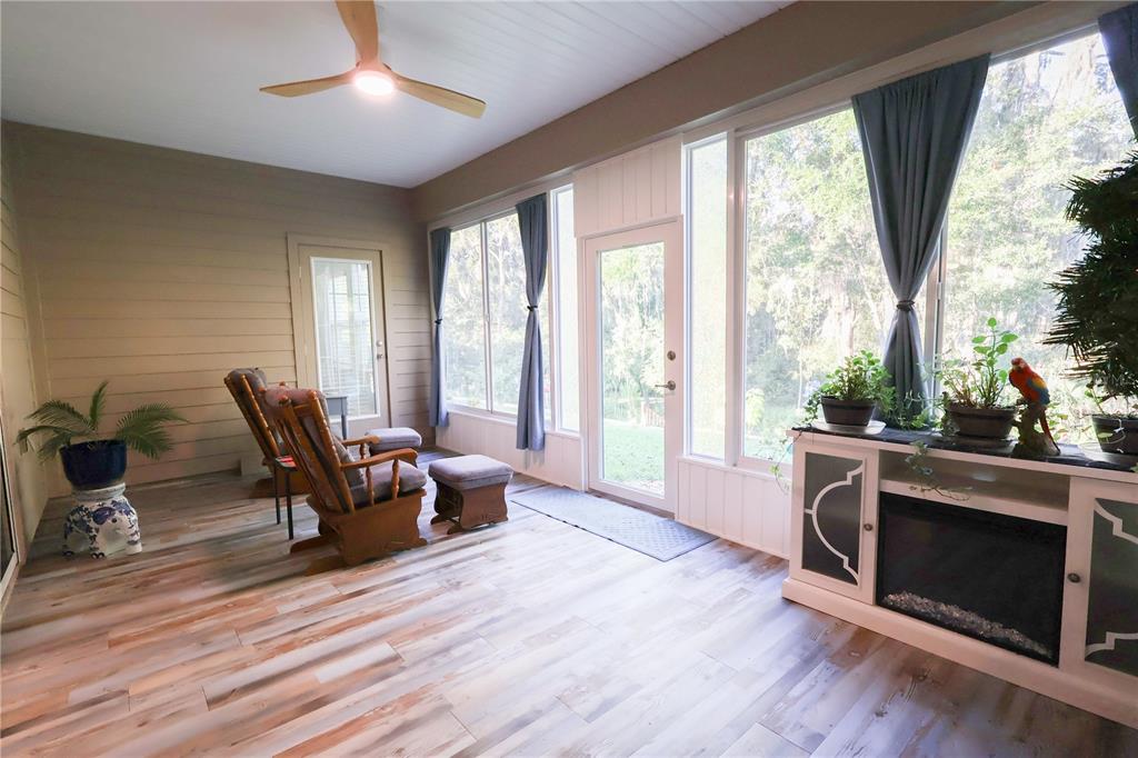 19511 Southwest 77th Loop Dunnellon, FL 34432 - Photo 19 of 27 a living room with furniture and a fireplace