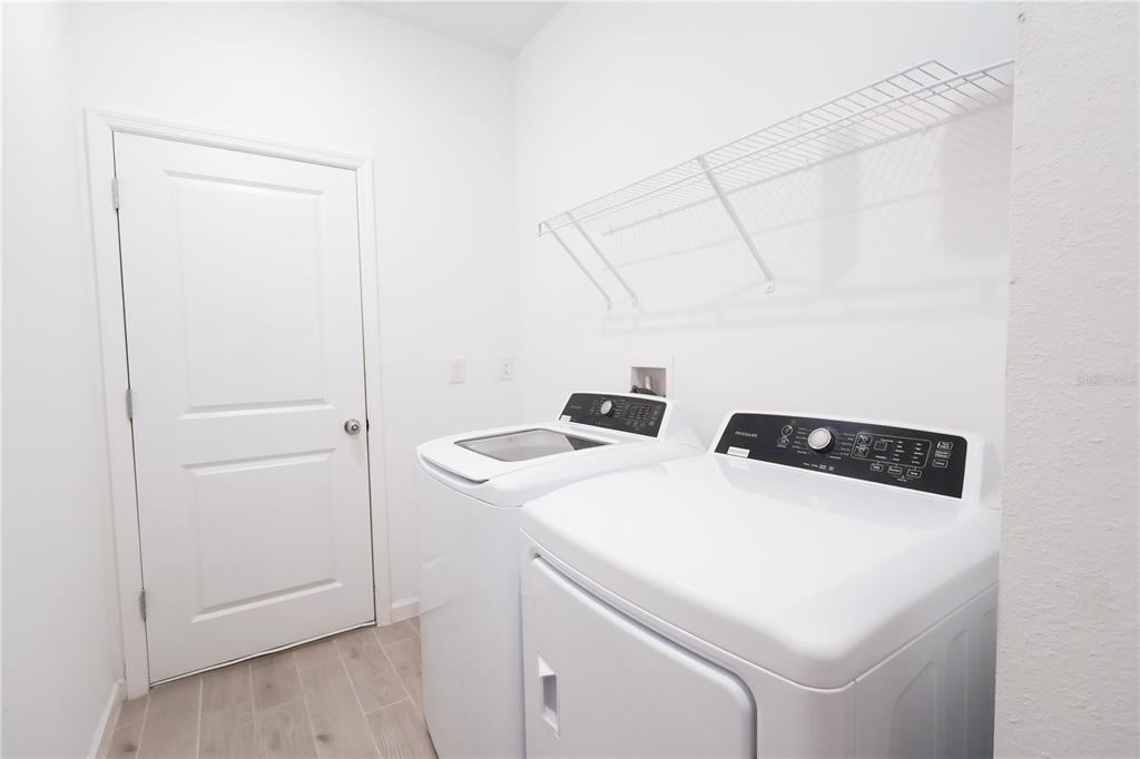 19511 Southwest 77th Loop Dunnellon, FL 34432 - Photo 21 of 27 a utility room with dryer and washer