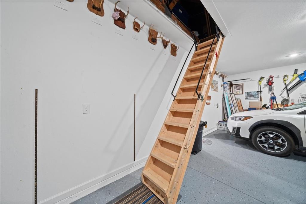 19511 Southwest 77th Loop Dunnellon, FL 34432 - Photo 22 of 27 a view of a livingroom with stairs and furniture