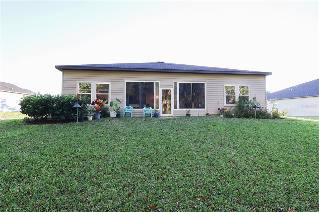 19511 Southwest 77th Loop Dunnellon, FL 34432 - Photo 23 of 27 a front view of house with yard and green space