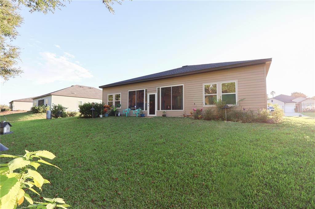 19511 Southwest 77th Loop Dunnellon, FL 34432 - Photo 24 of 27 a view of a house with backyard