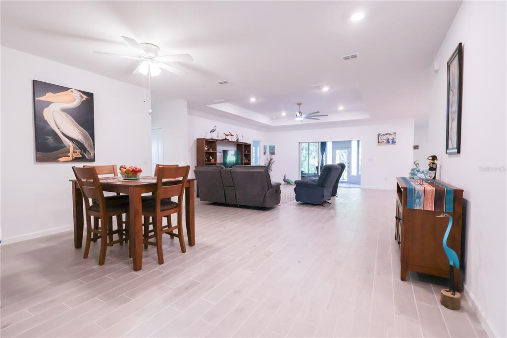 19511 Southwest 77th Loop Dunnellon, FL 34432 - Photo 4 of 27 a view of a dining room with furniture and chandelier
