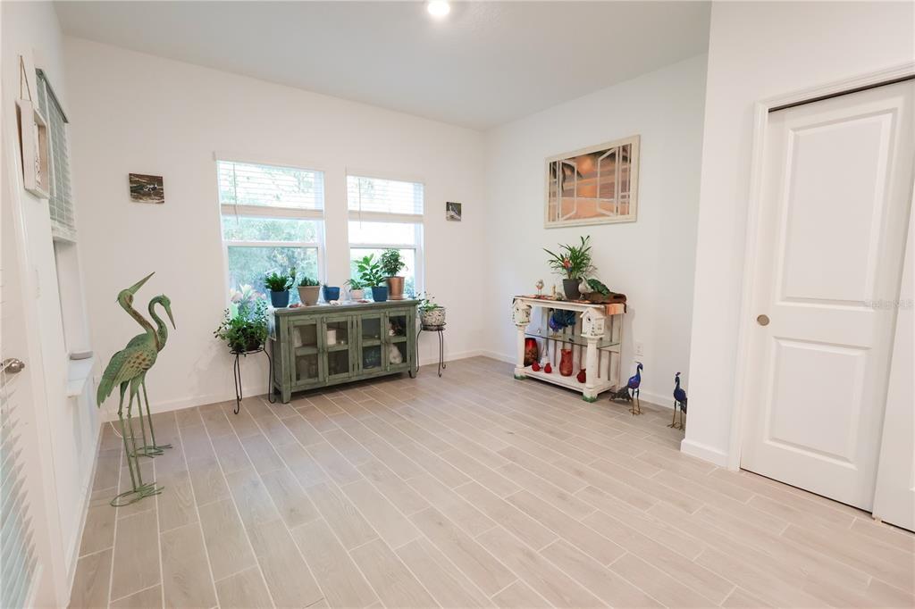 19511 Southwest 77th Loop Dunnellon, FL 34432 - Photo 9 of 27 a living room with furniture and a large window