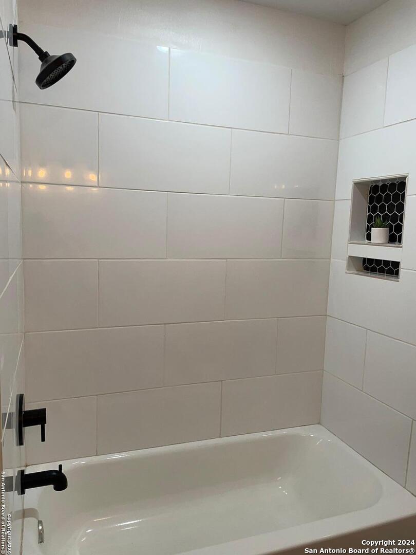 210 County Road 4643 Hondo, TX 78861 - Photo 11 of 12 a bathroom with a shower and a bathtub