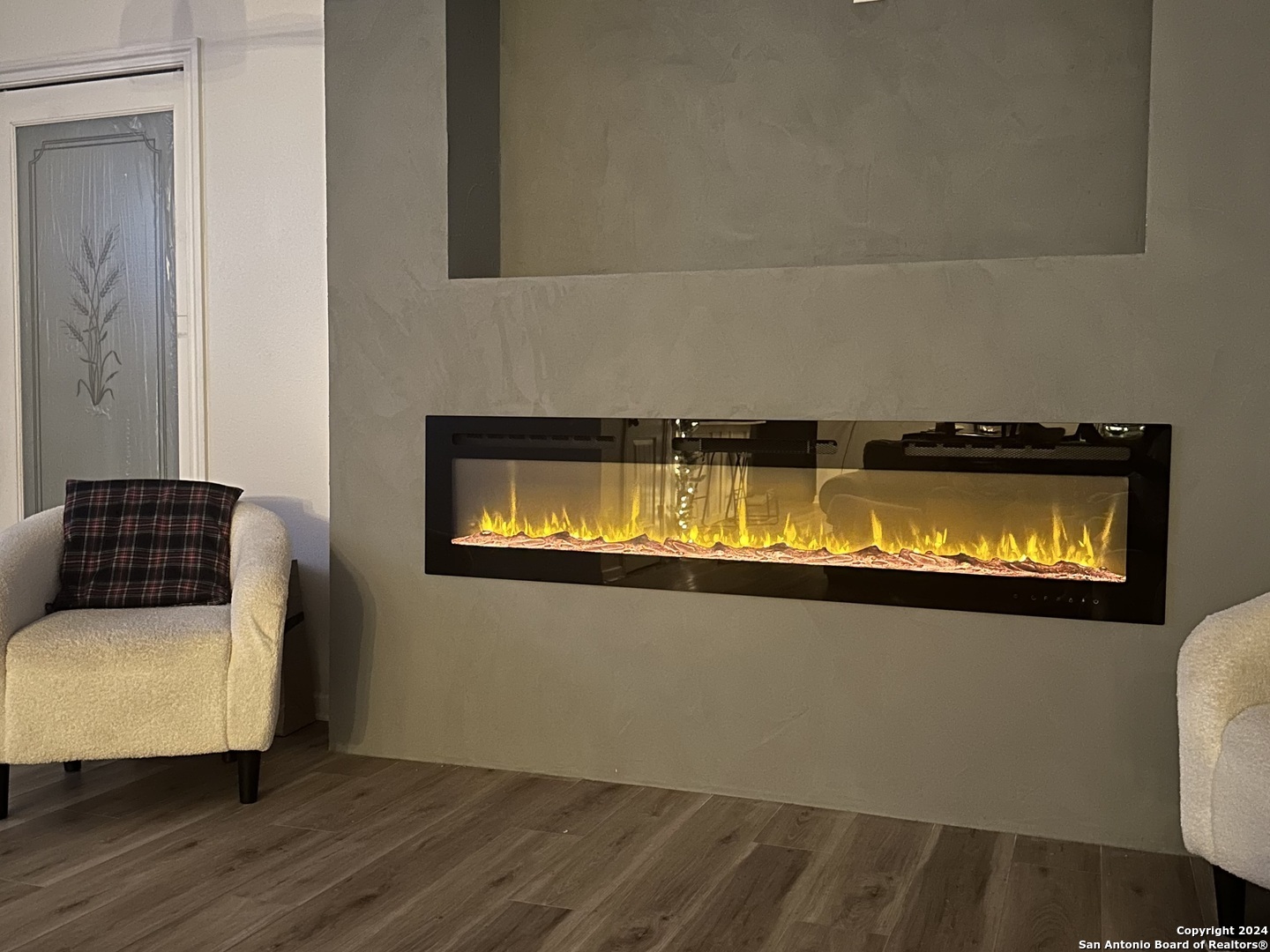 210 County Road 4643 Hondo, TX 78861 - Photo 3 of 12 a living room with a couch and chandelier