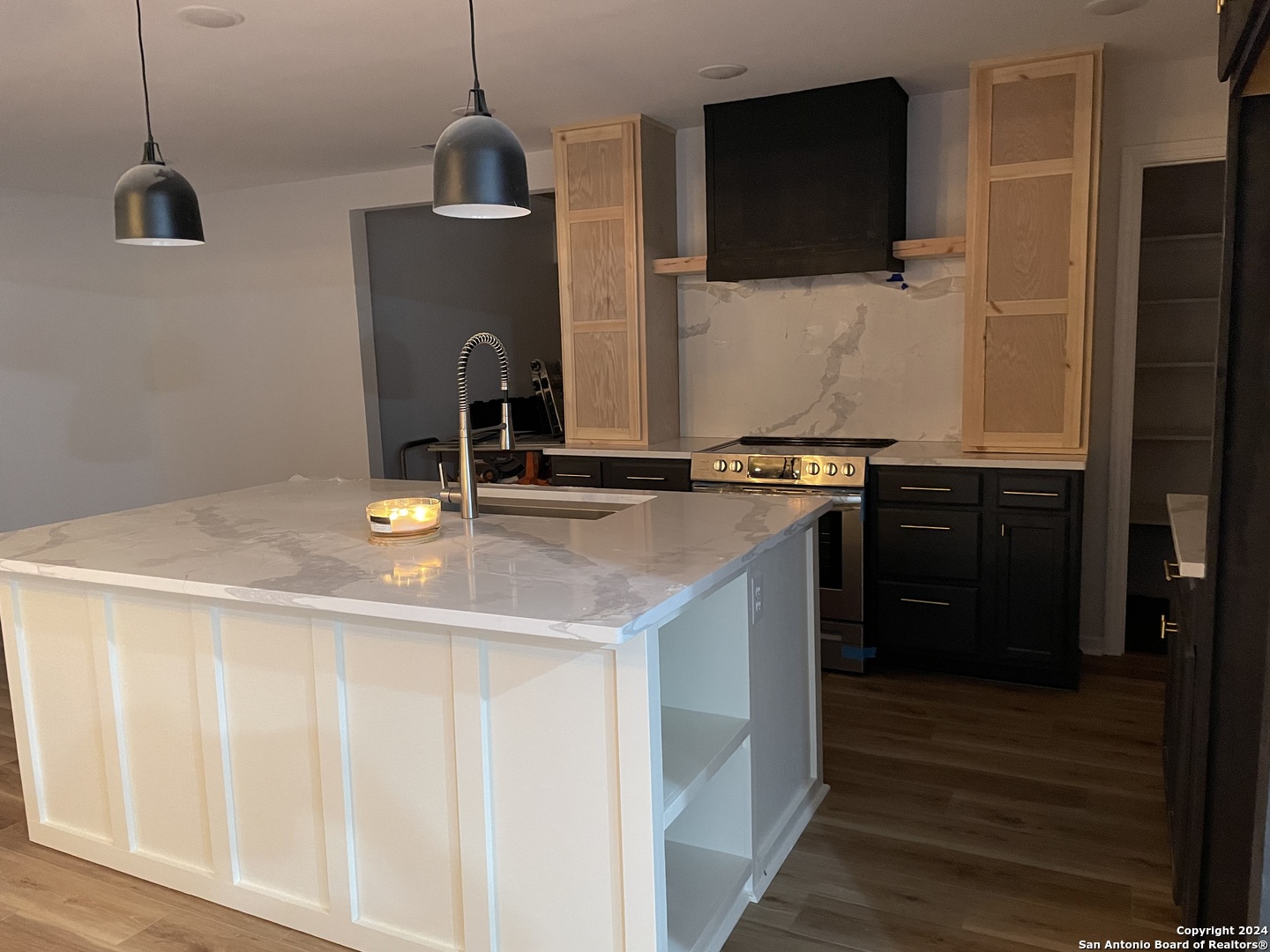210 County Road 4643 Hondo, TX 78861 - Photo 5 of 12 a kitchen with a sink and a stove top oven