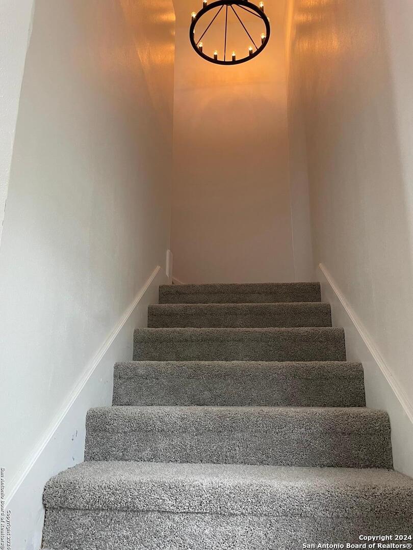 210 County Road 4643 Hondo, TX 78861 - Photo 8 of 12 a view of staircase with white walls