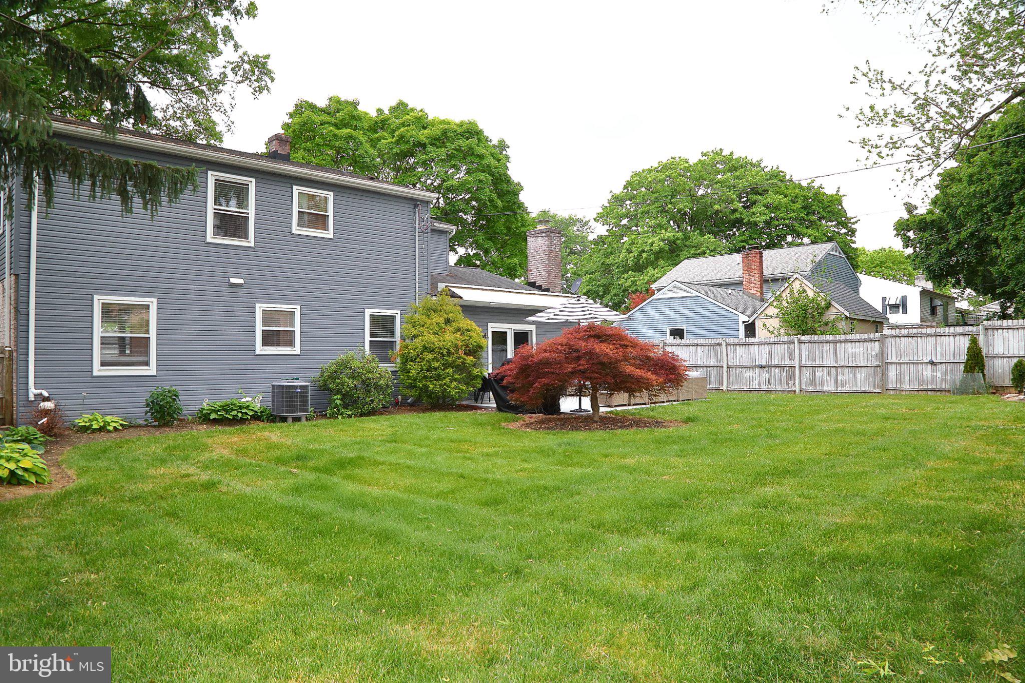 445 Haverhill Road Lancaster, PA 17601 - Photo 7 of 47 Lush backyard oasis with vibrant greenery.
