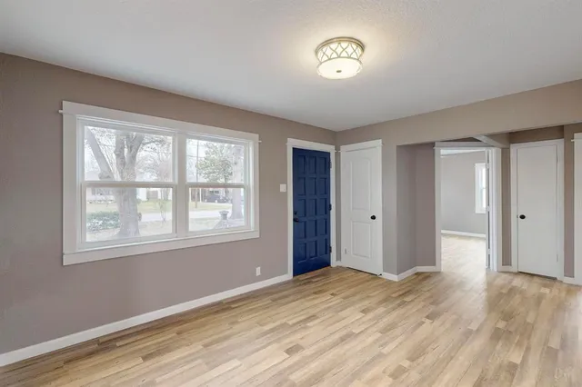 a view of a hallway with a kitchen