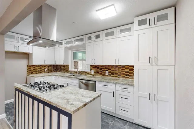 a kitchen with a stove and a refrigerator