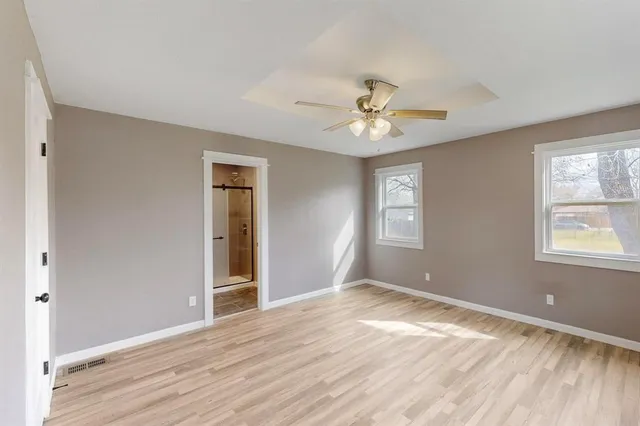 a view of an empty room with a window