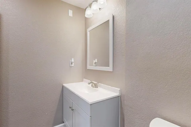 a bathroom with a shower and a toilet