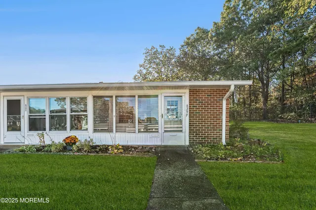 front view of a house with a yard