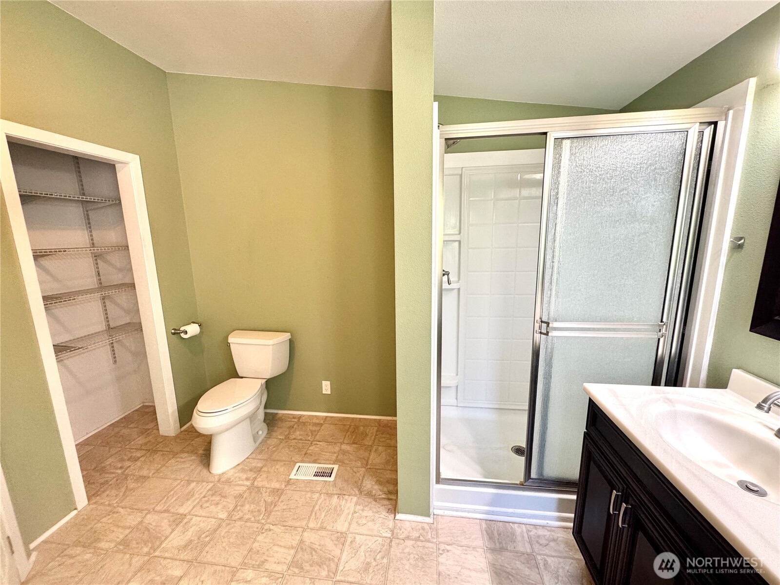 1218 South 3rd Street Dayton, WA 99328 - Photo 18 of 23 a bathroom with a granite countertop sink toilet and shower