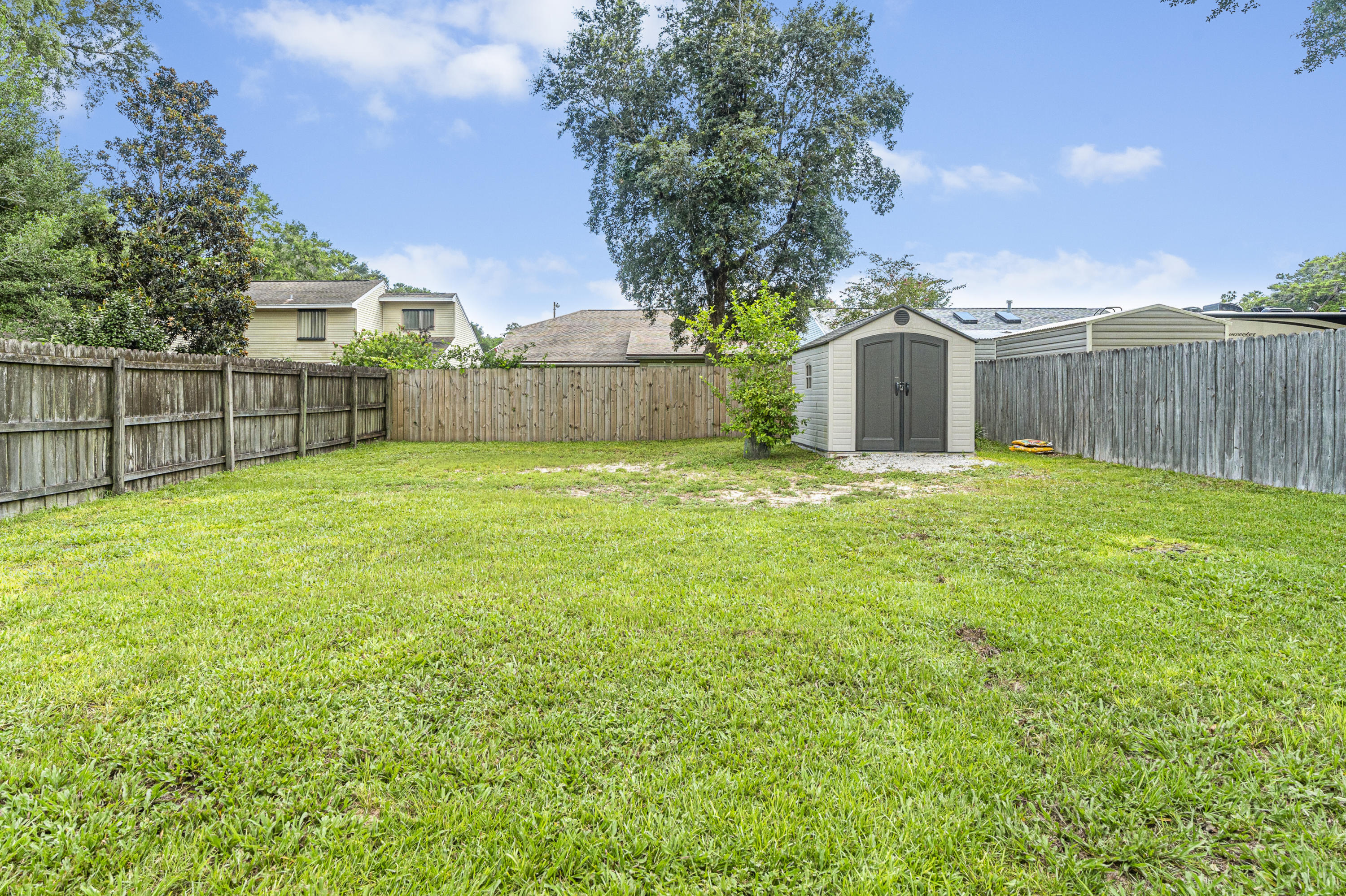 520 Springwood Way Niceville, FL 32578 - Photo 5 of 5 a view of a back yard of the house and green space
