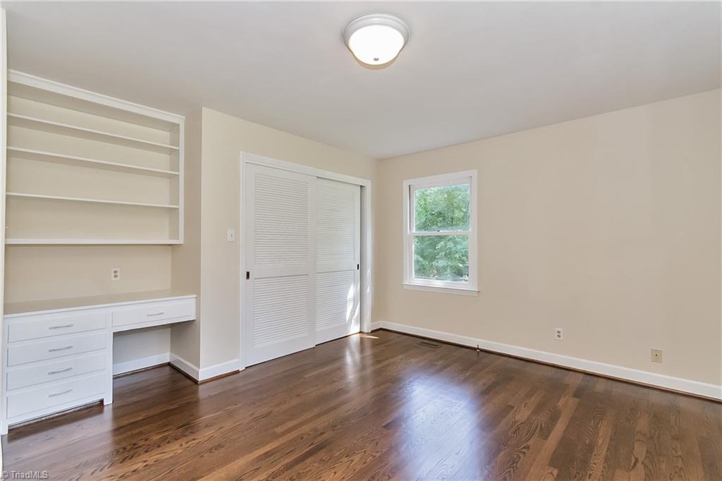 2278 Huffman Mill Road Burlington, NC 27215 - Photo 10 of 24 Downstairs bedroom with built-in desk.