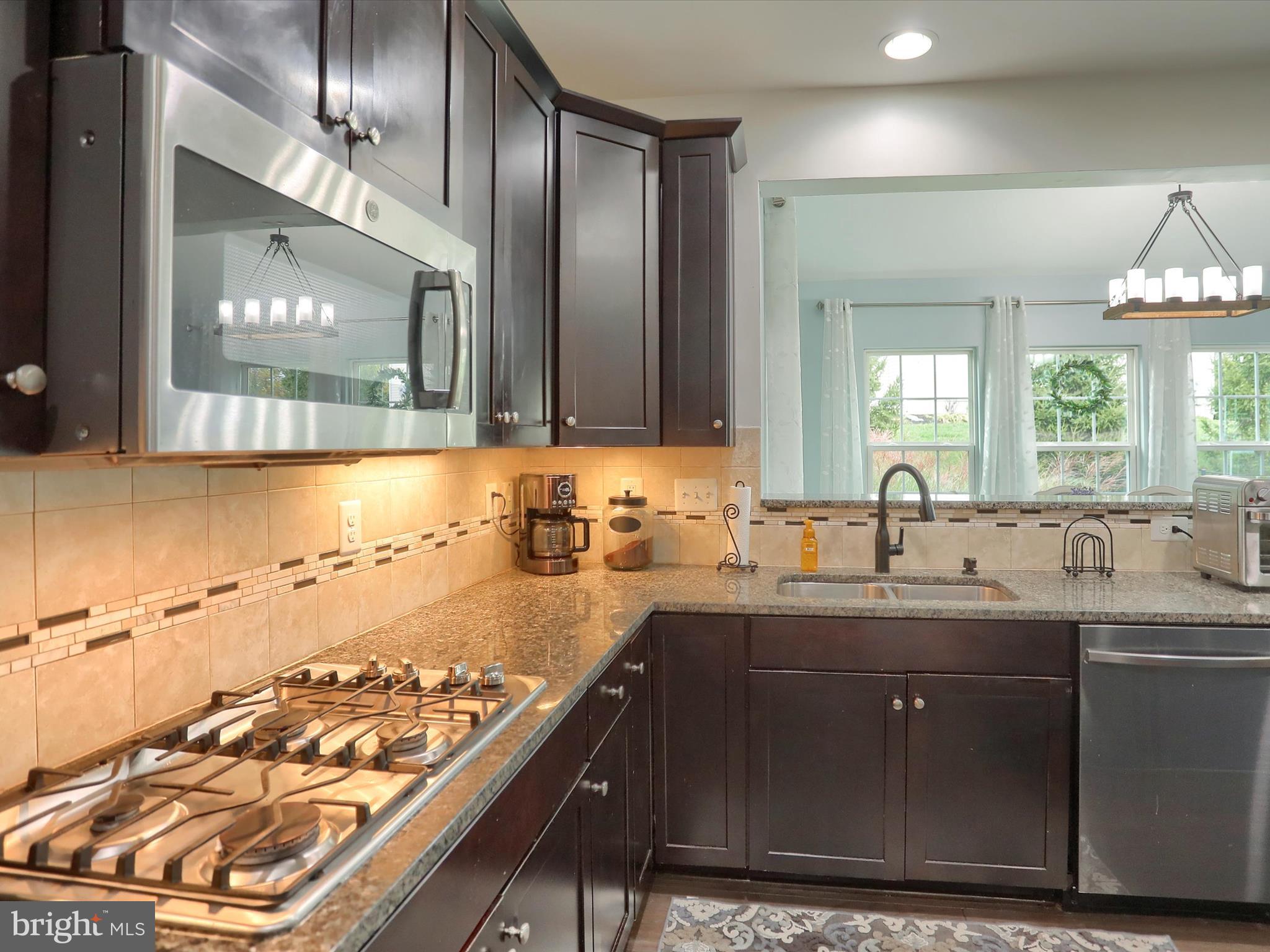 3930 Seattle Slew Drive Harrisburg, PA 17112 - Photo 12 of 48 a kitchen with a sink and a stove top oven