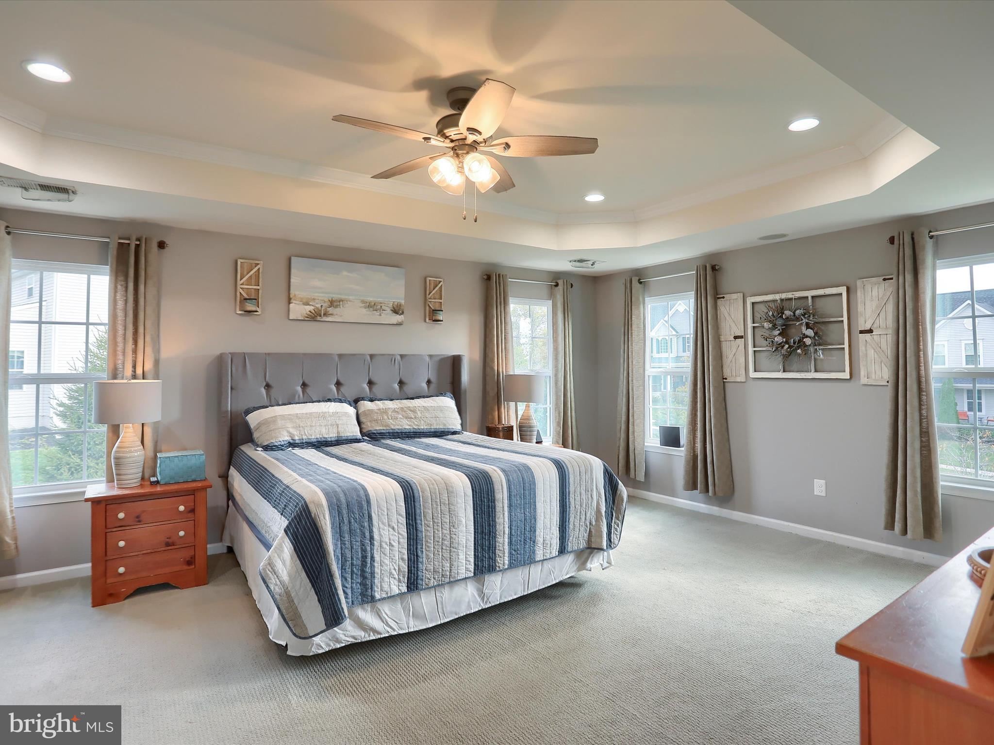 3930 Seattle Slew Drive Harrisburg, PA 17112 - Photo 16 of 48 a spacious bedroom with a bed and a chandelier