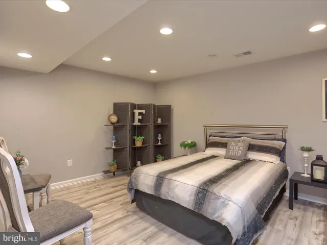 a bedroom with a bed and furniture