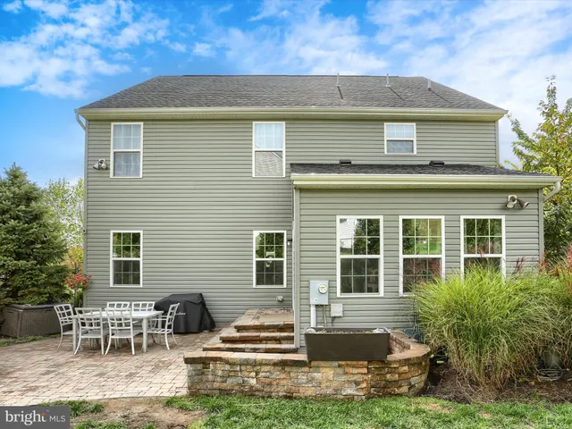 a front view of house with yard and outdoor seating