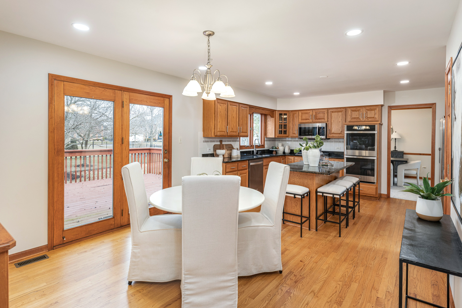 2703 Wait Road Naperville, IL 60564 - Photo 11 of 35 a view of a dining room with furniture window and wooden floor
