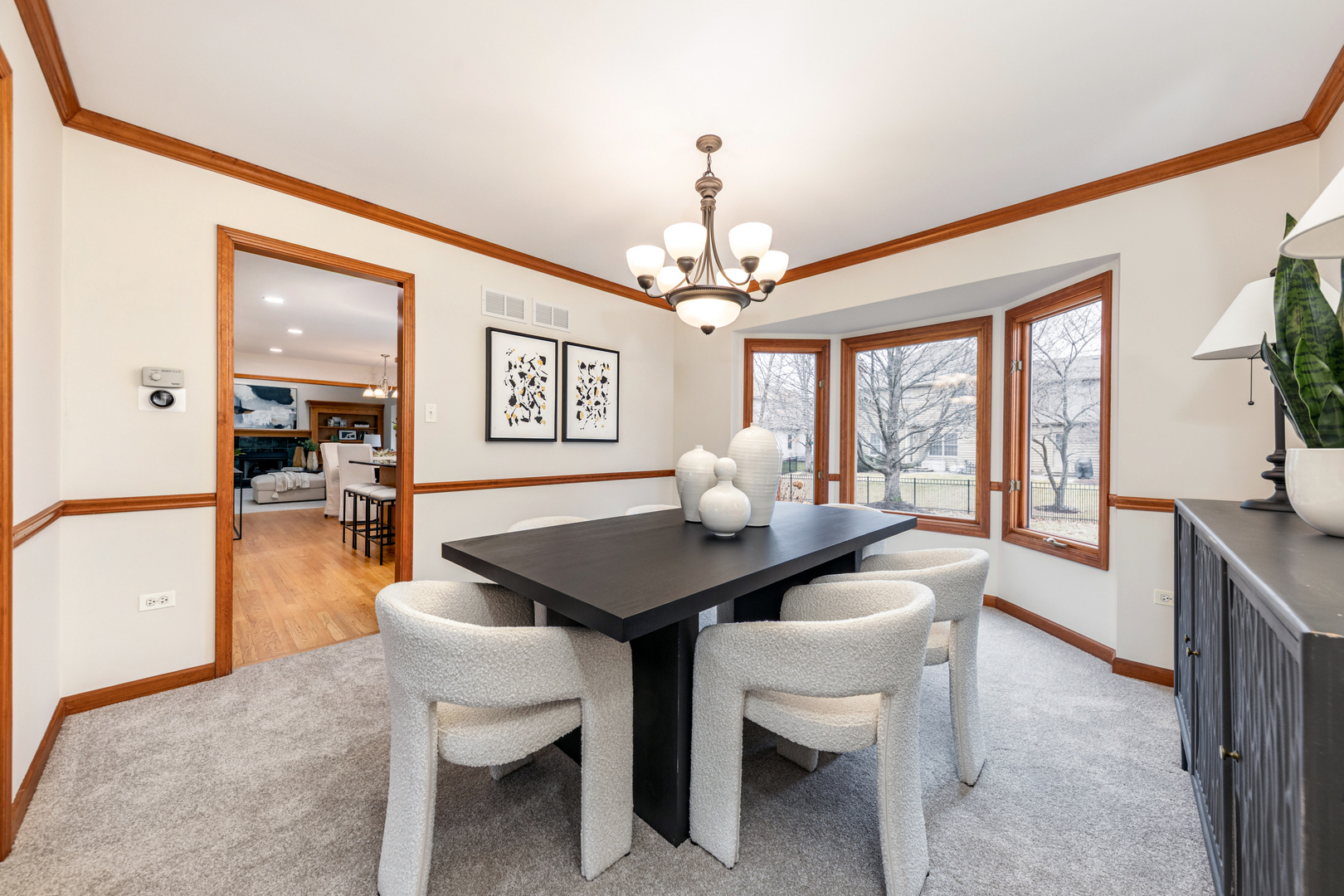 2703 Wait Road Naperville, IL 60564 - Photo 7 of 35 a dining room with furniture a chandelier and window