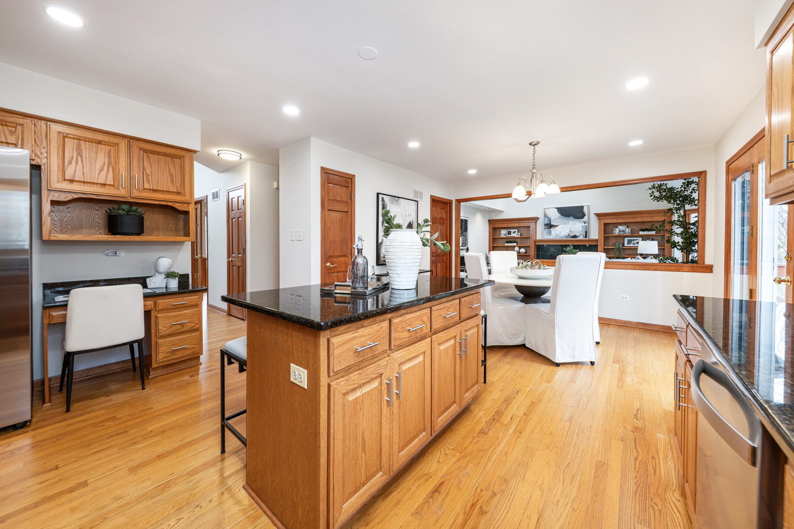 2703 Wait Road Naperville, IL 60564 - Photo 10 of 35 a kitchen with stainless steel appliances kitchen island granite countertop a stove top oven a sink a dining table and chairs