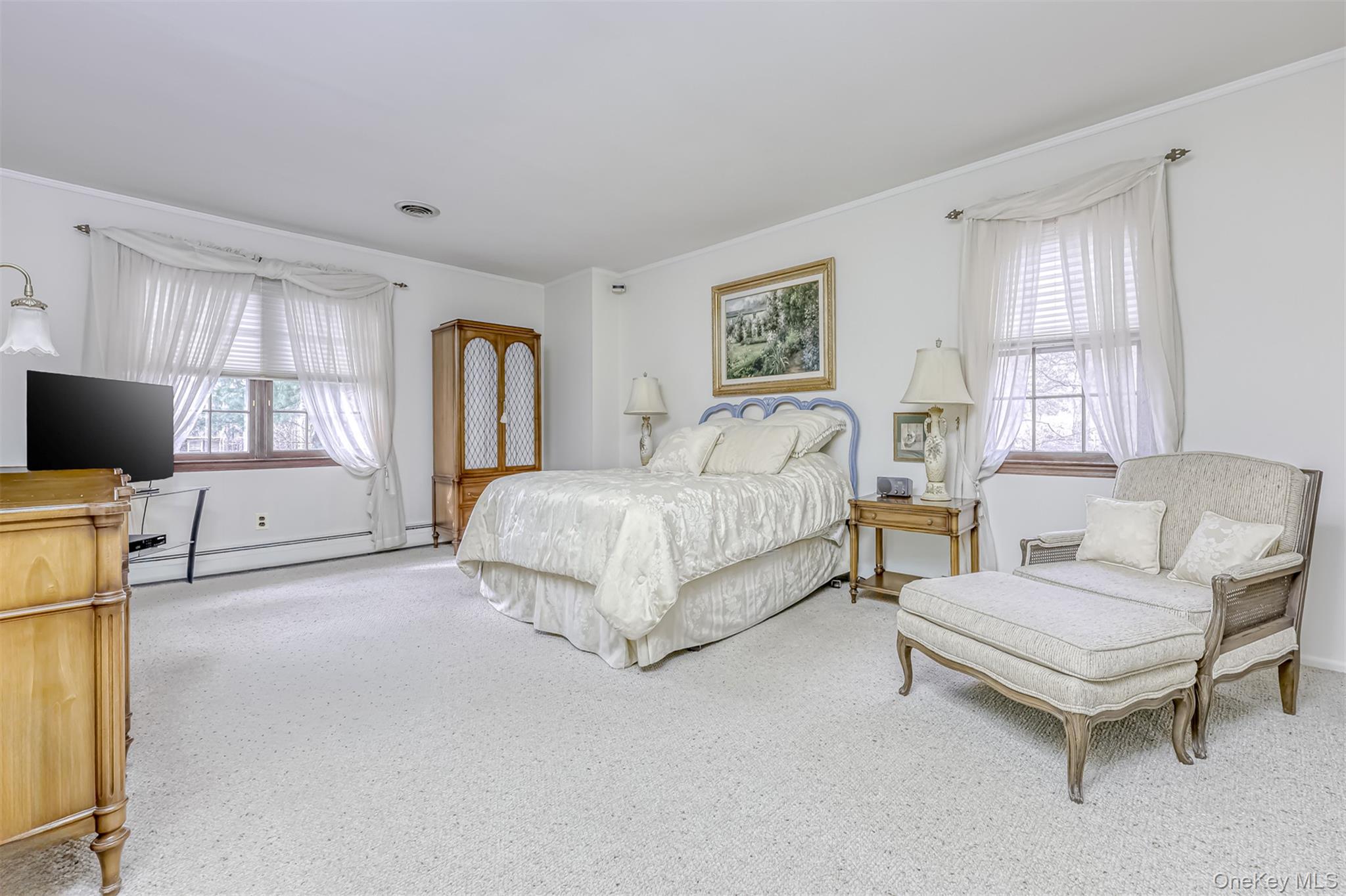 16 Kings Gate Road Suffern, NY 10901 - Photo 12 of 21 a spacious bedroom with a bed and a couch
