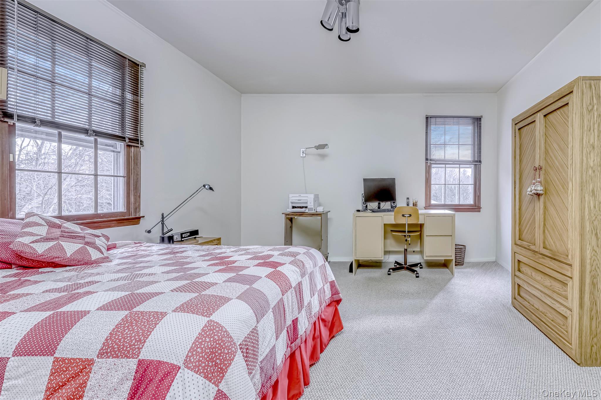 16 Kings Gate Road Suffern, NY 10901 - Photo 16 of 21 a bedroom with a bed and flat screen tv