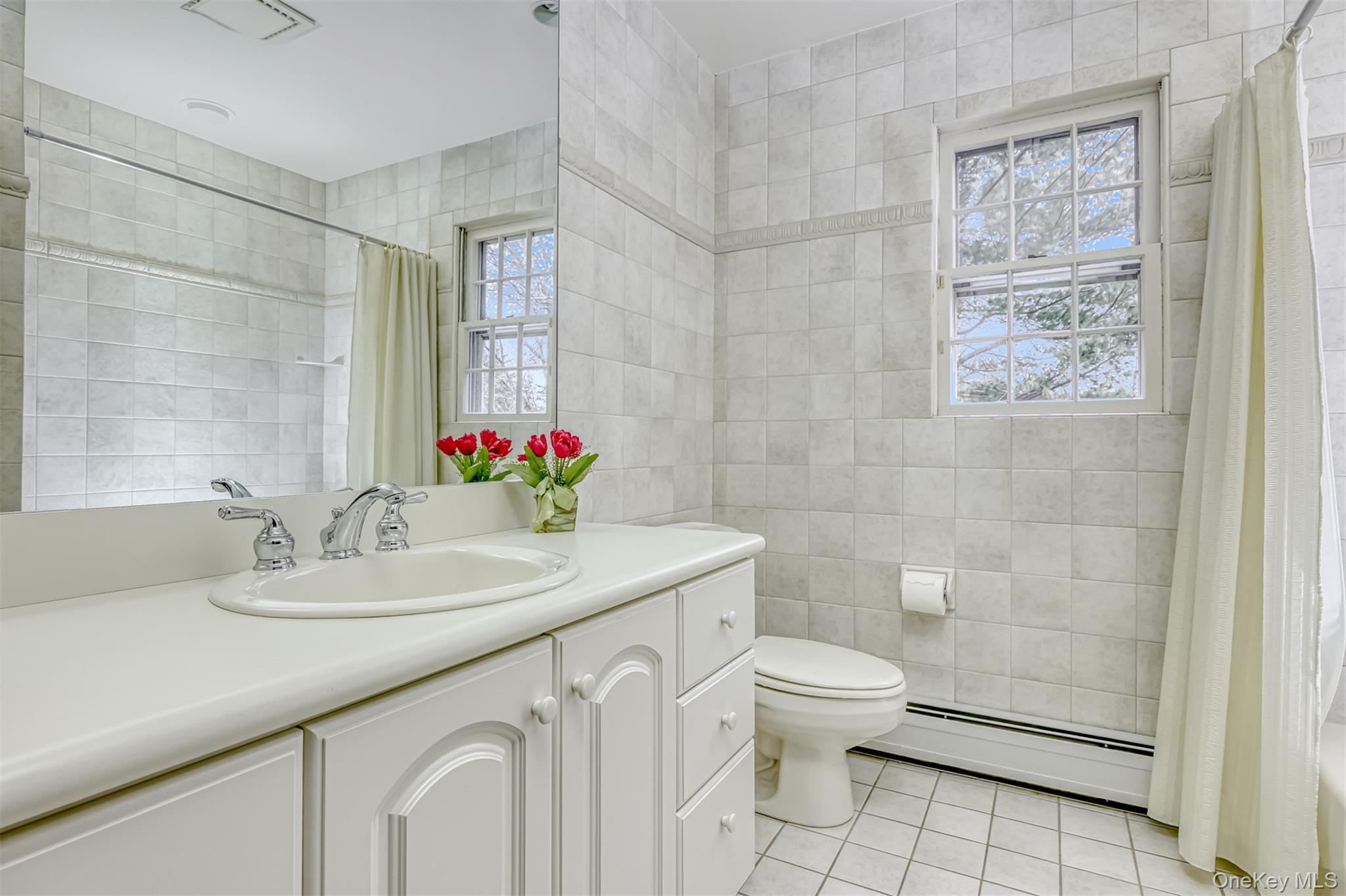 16 Kings Gate Road Suffern, NY 10901 - Photo 17 of 21 a bathroom with a sink a toilet and shower