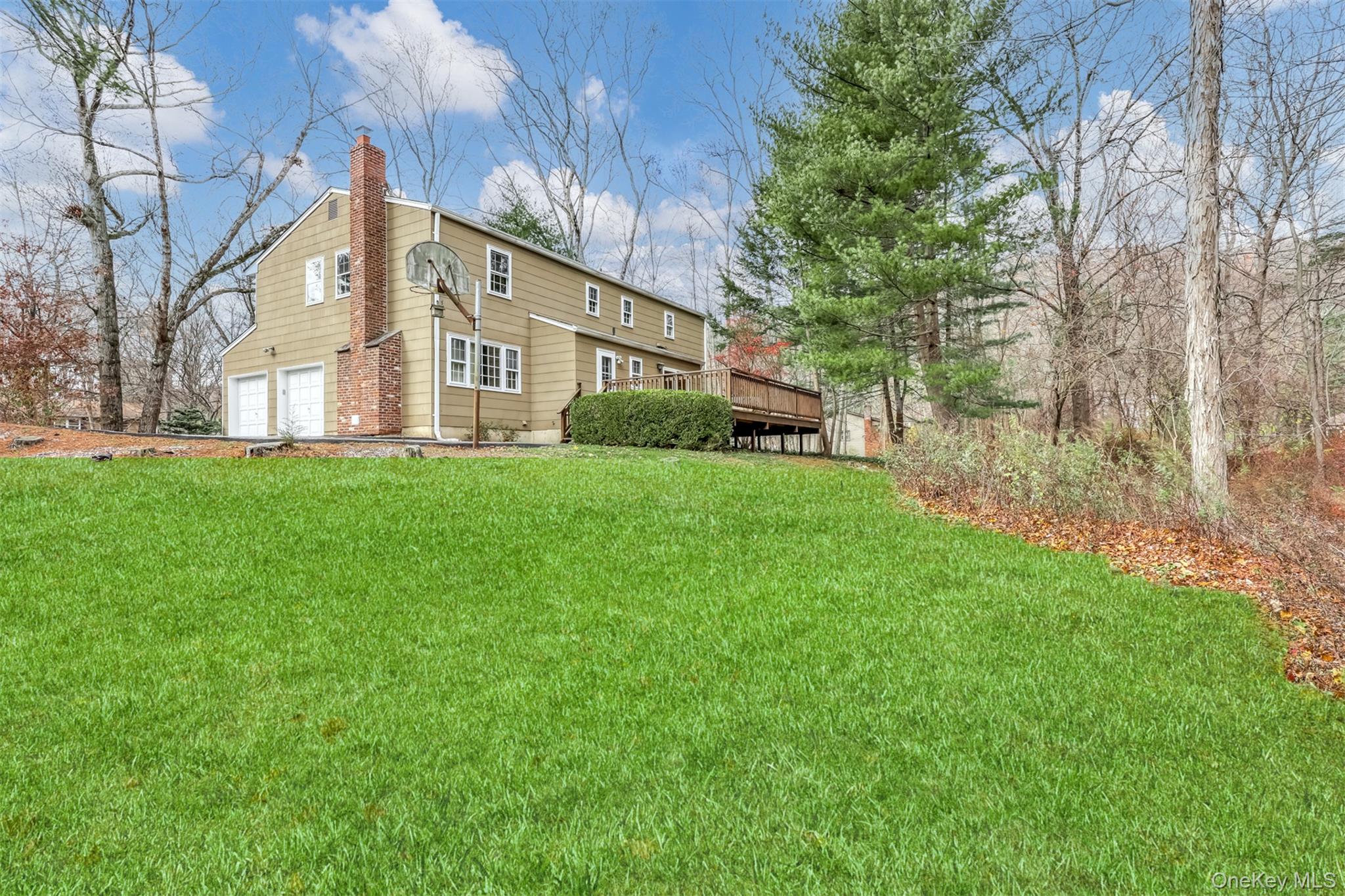 16 Kings Gate Road Suffern, NY 10901 - Photo 20 of 21 a view of a house with a big yard and large trees