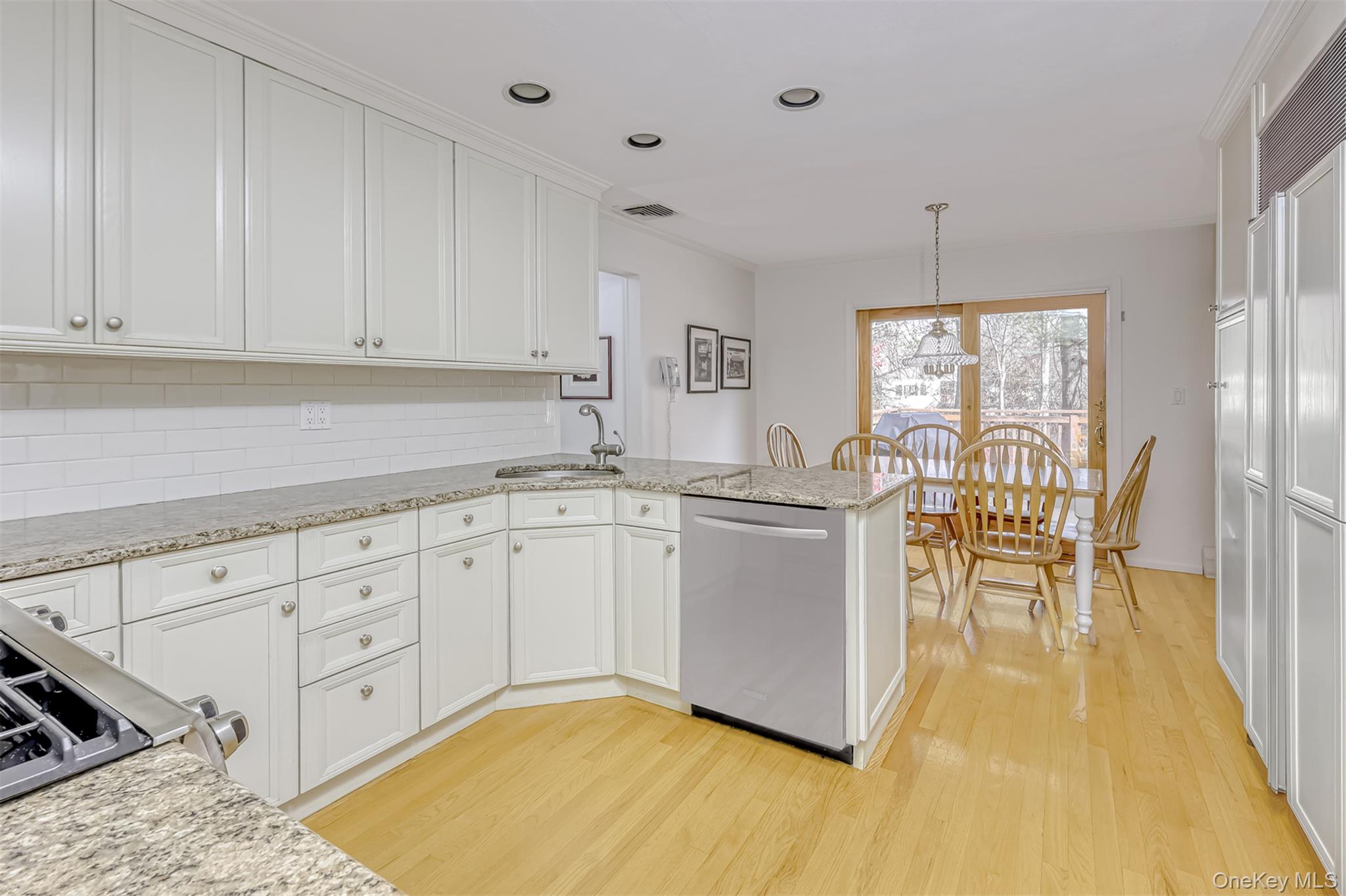 16 Kings Gate Road Suffern, NY 10901 - Photo 8 of 21 a kitchen with granite countertop white cabinets and white appliances