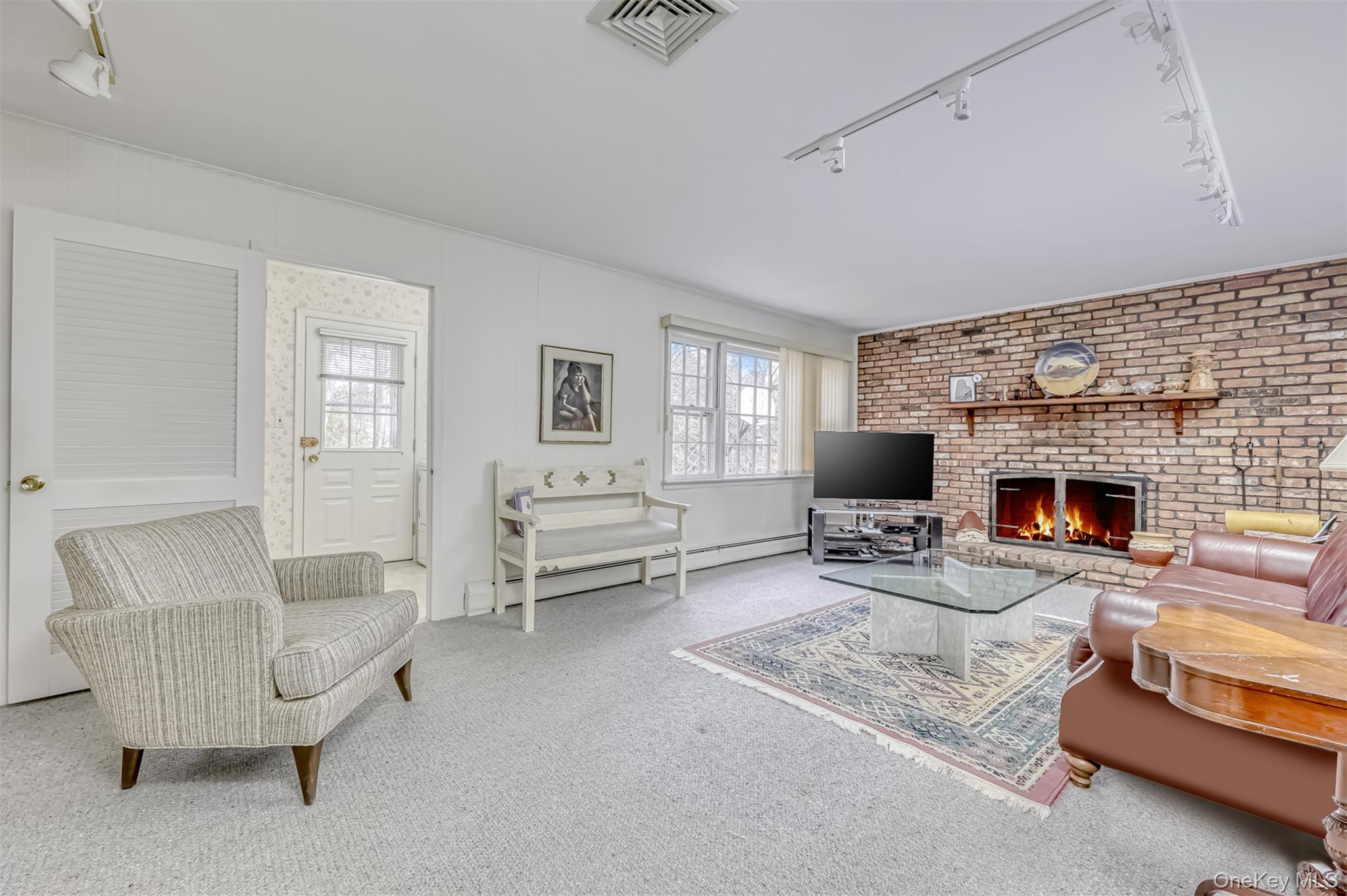 16 Kings Gate Road Suffern, NY 10901 - Photo 10 of 21 a living room with furniture and a fireplace