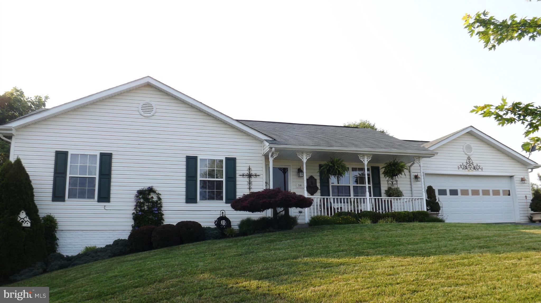36 Roger Court Ranson, WV 25438 - Photo 1 of 29 a view of a house with a yard and potted plants