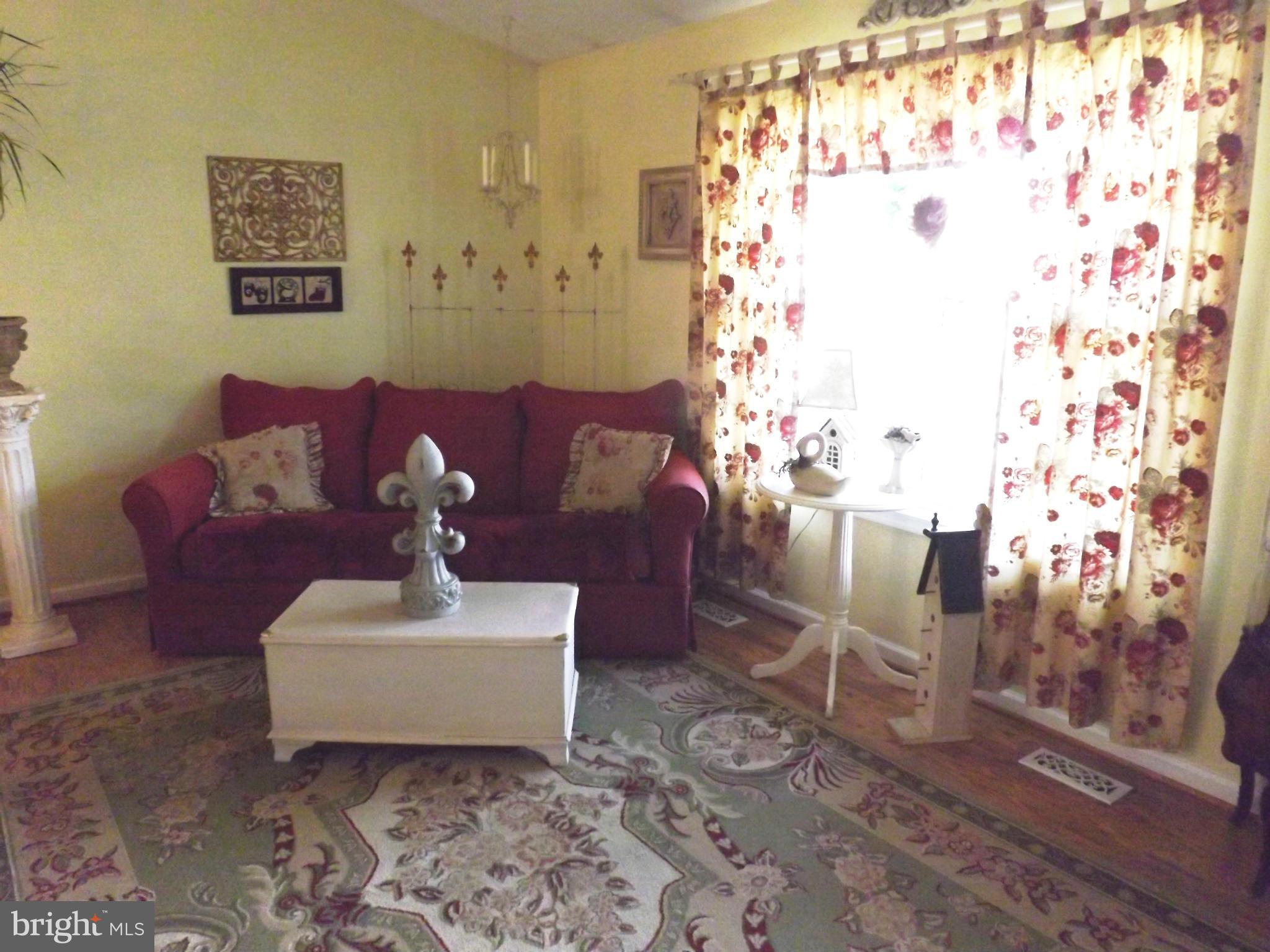 36 Roger Court Ranson, WV 25438 - Photo 2 of 29 a living room with furniture and wooden floor