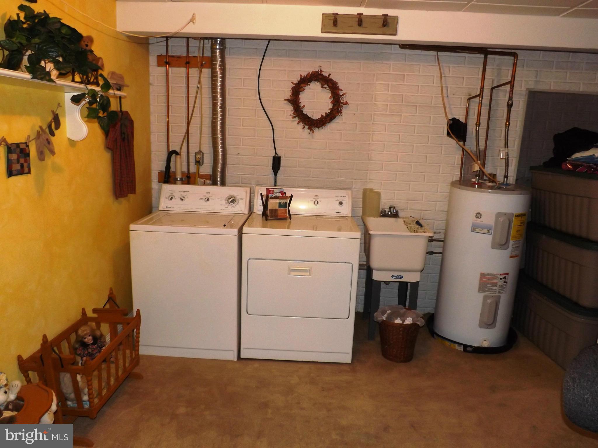 36 Roger Court Ranson, WV 25438 - Photo 17 of 29 a utility room with dryer and washer