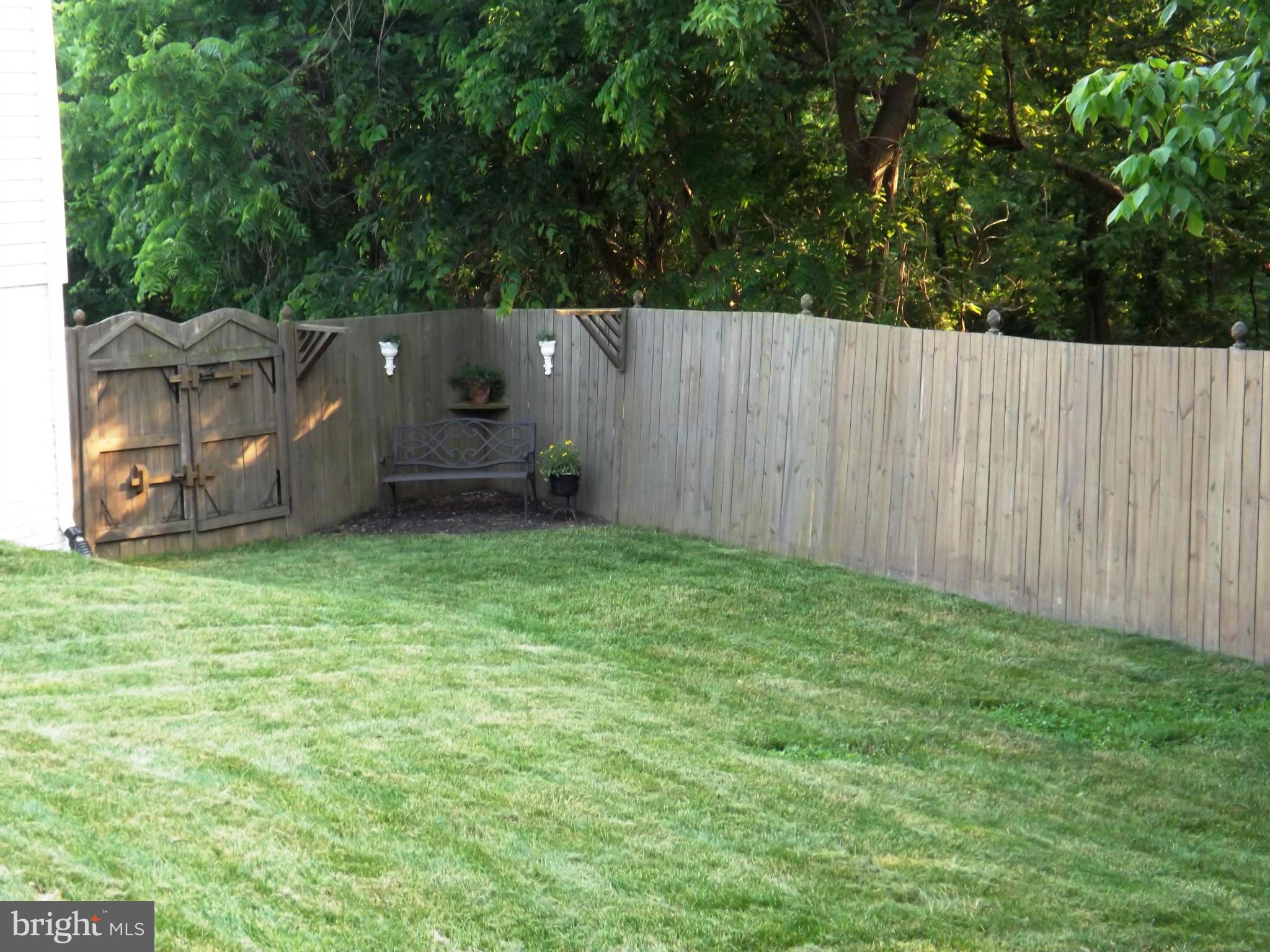 36 Roger Court Ranson, WV 25438 - Photo 23 of 29 an outdoor space with wooden fence
