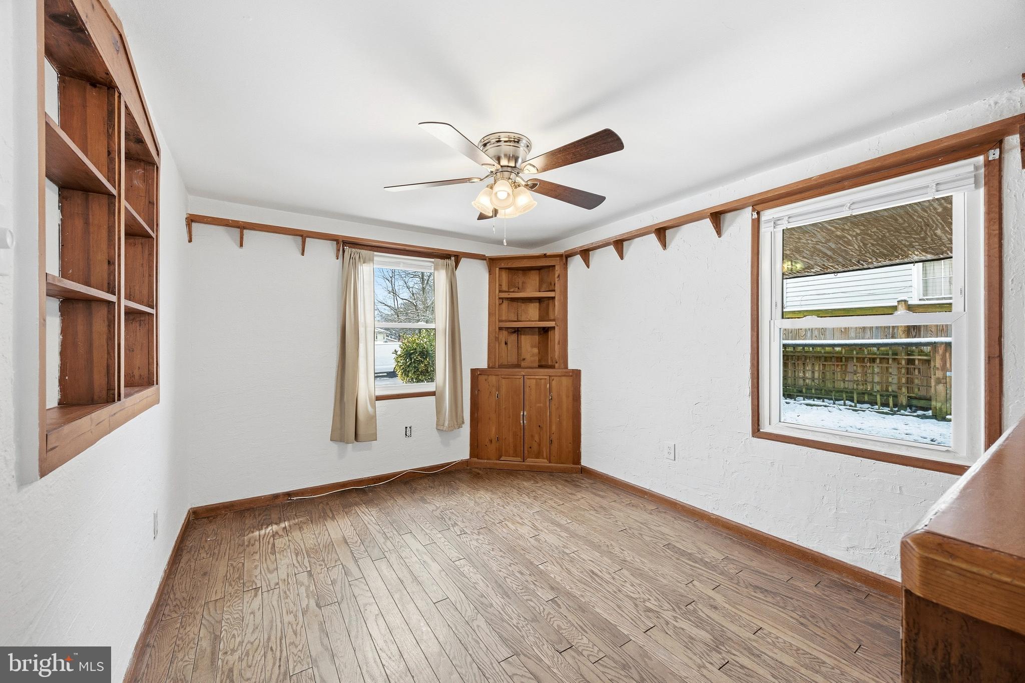 652 Chapelview Drive Odenton, MD 21113 - Photo 11 of 50 a view of an empty room with a window and wooden floor