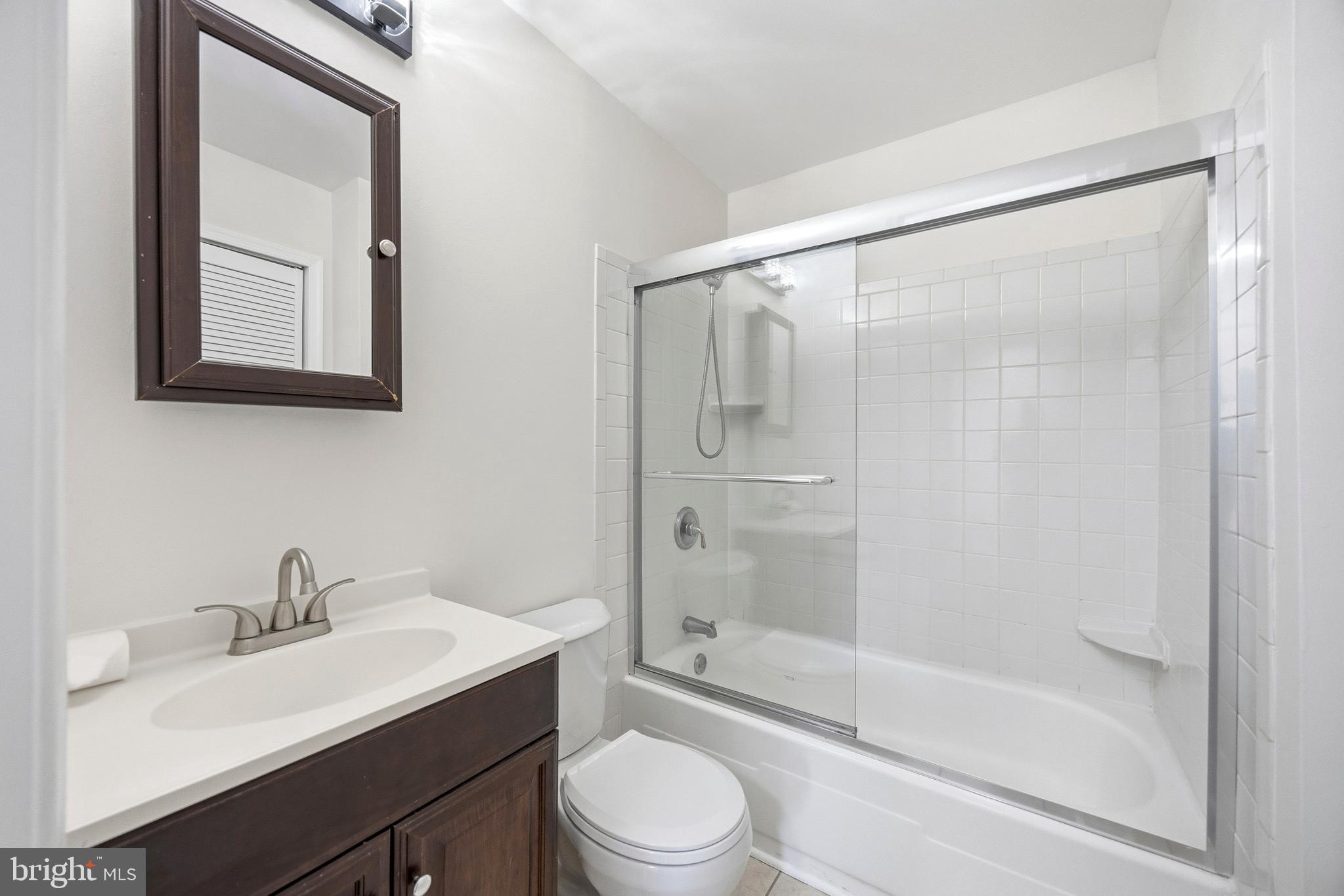 652 Chapelview Drive Odenton, MD 21113 - Photo 26 of 50 a bathroom with a sink a toilet and shower