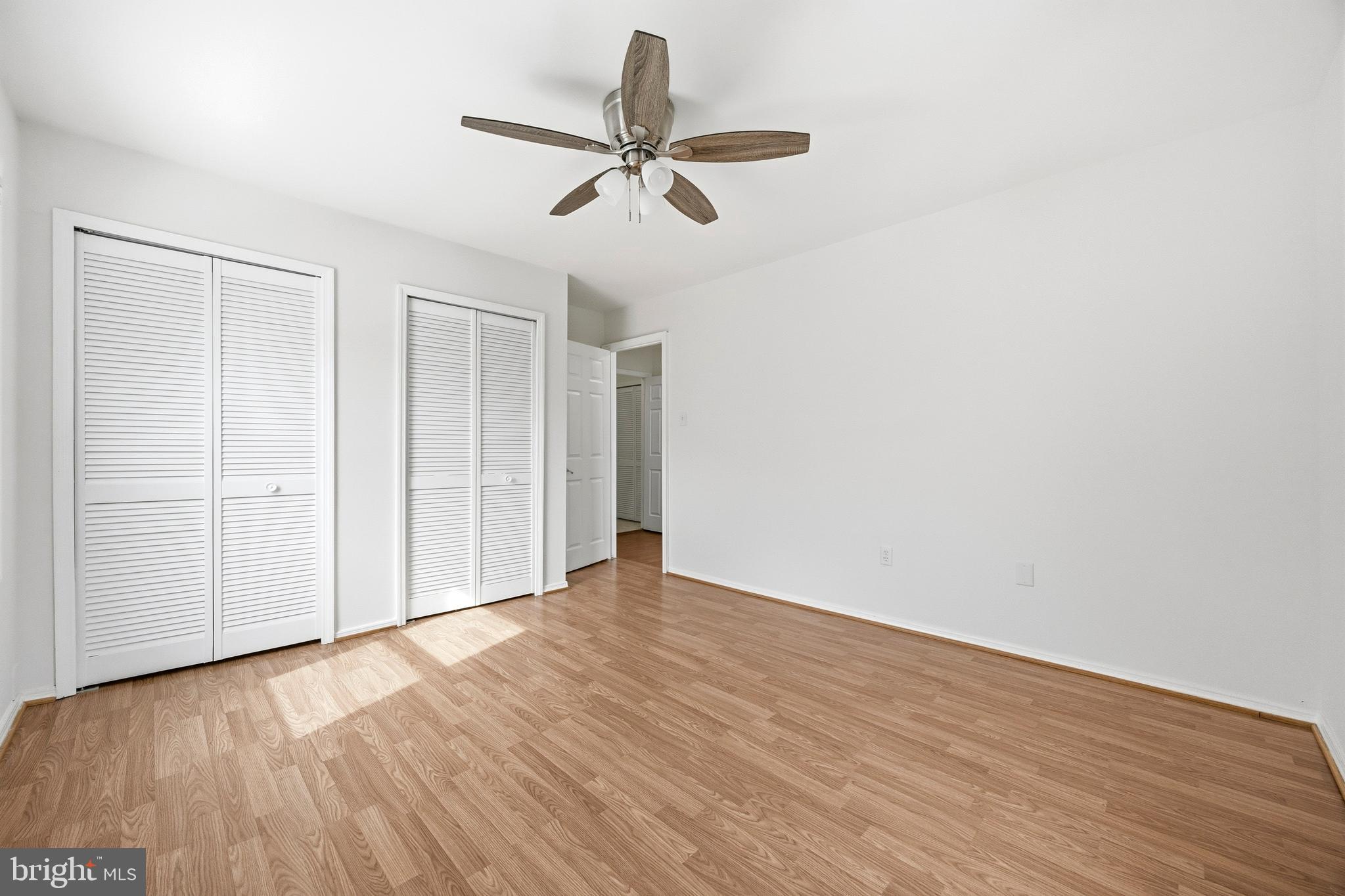 652 Chapelview Drive Odenton, MD 21113 - Photo 32 of 50 an empty room with wooden floor fan and windows