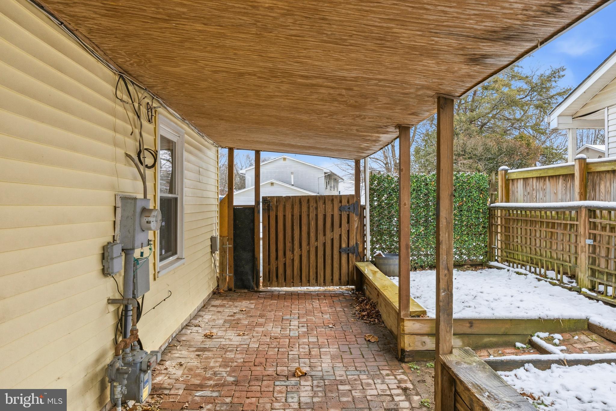 652 Chapelview Drive Odenton, MD 21113 - Photo 50 of 50 a view of a porch with a floor to ceiling window and wooden fence
