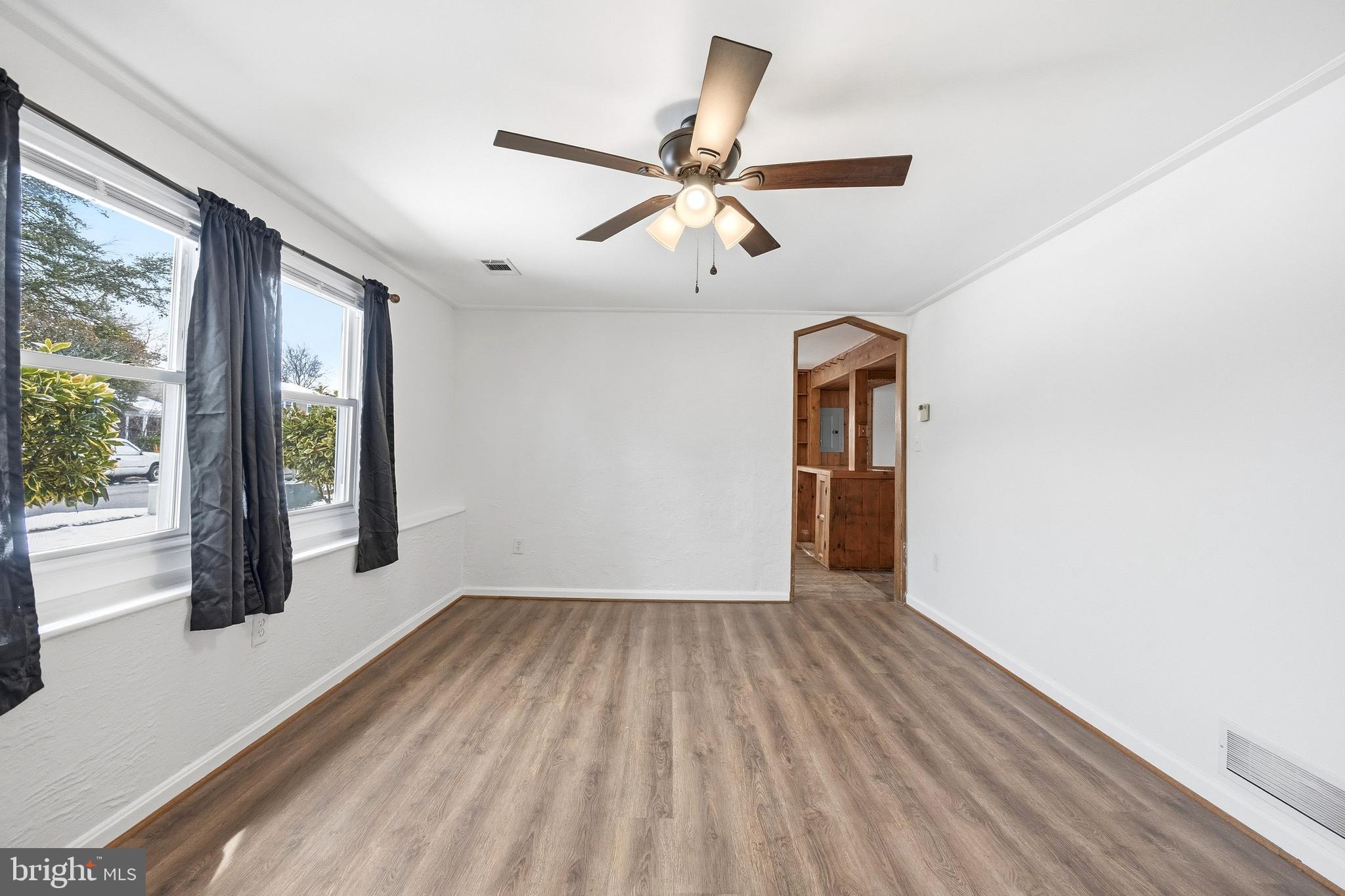 652 Chapelview Drive Odenton, MD 21113 - Photo 8 of 50 a view of empty room with wooden floor and fan