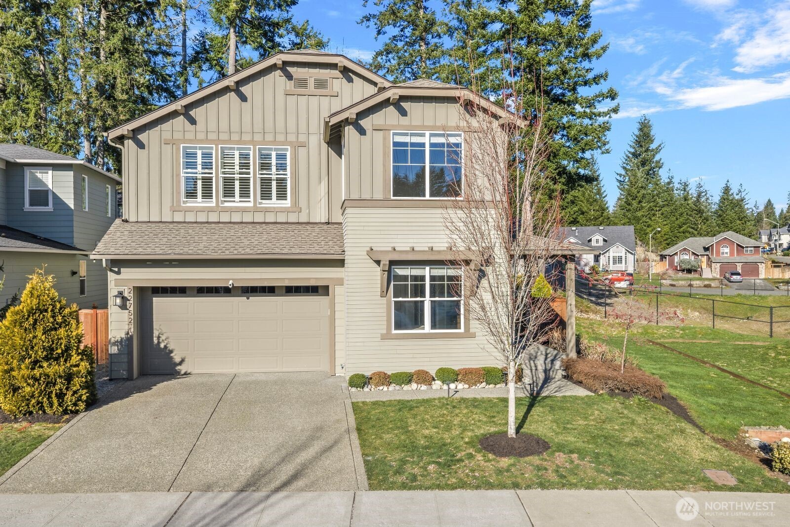 a front view of a house with a yard