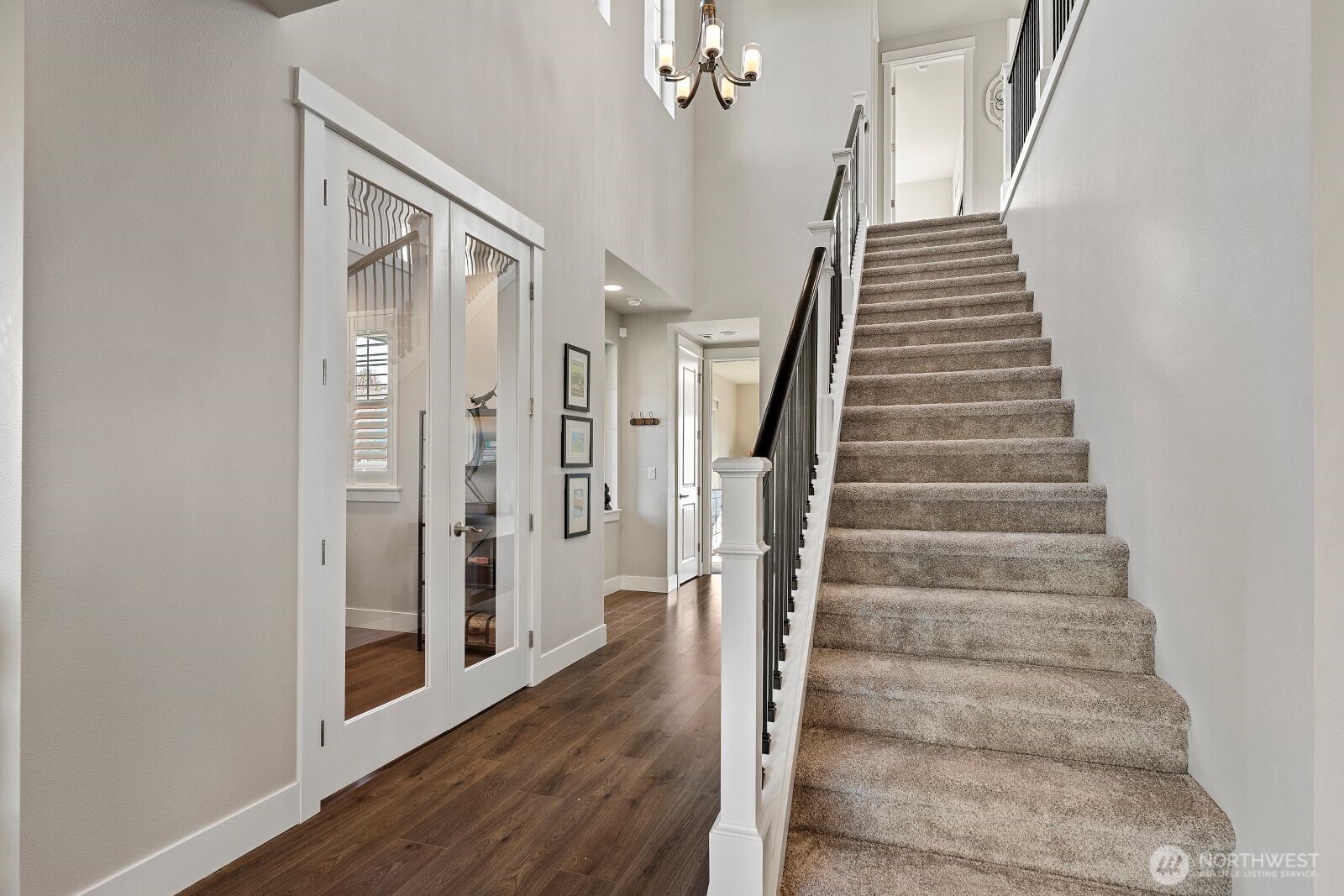 22752 Southeast 265th Place Maple Valley, WA 98038 - Photo 16 of 39 a view of an entryway with wooden floor and staircase