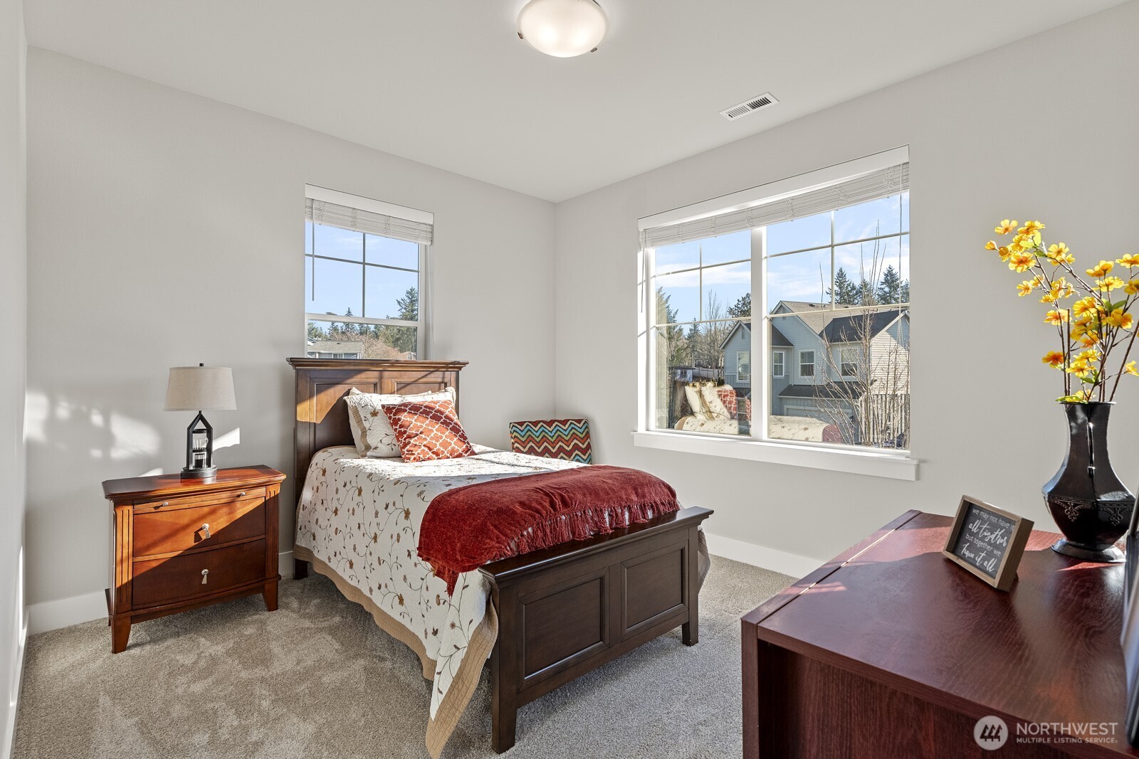 22752 Southeast 265th Place Maple Valley, WA 98038 - Photo 24 of 39 a bed room with a bed window and a table